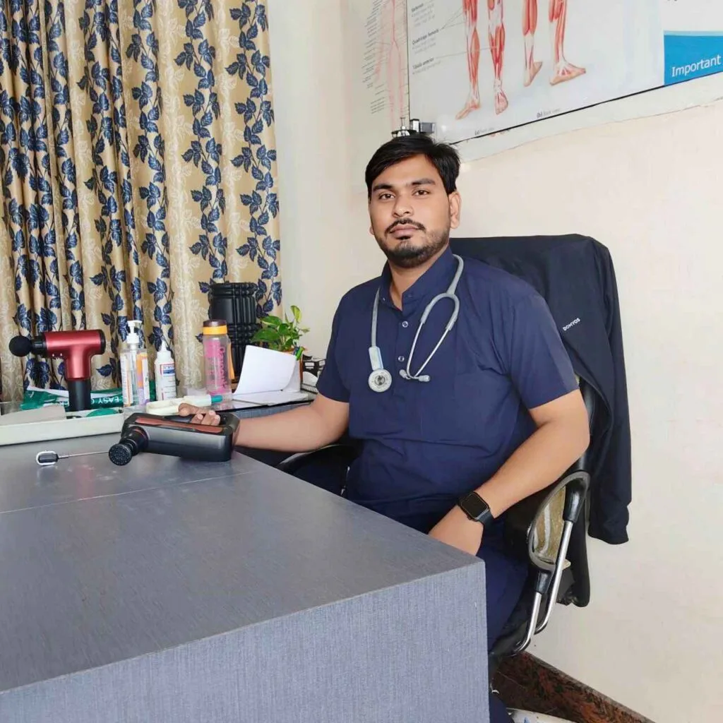 Dr. Harish Kumar using physiotherapy tool with stethoscope in clinic at PhysioCare247, Phulera